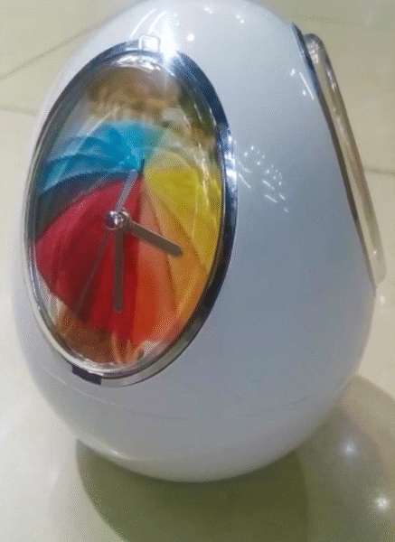 Egg Shaped Revolving Musical Photo Frame with Clock