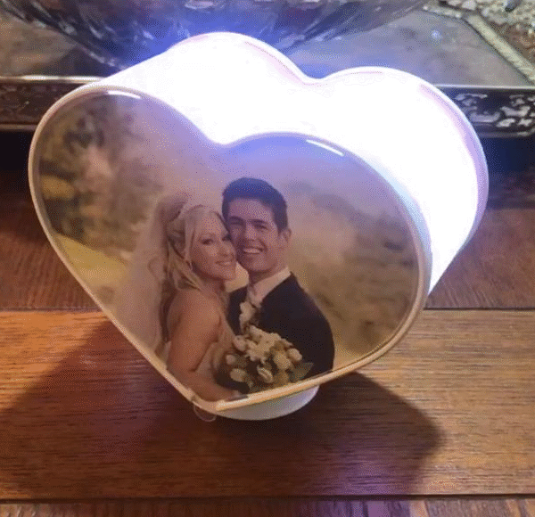 Heart-shaped revolving LED photo frame.